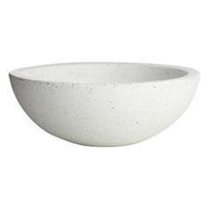 a white bowl with speckles on the rim is shown in front of a white background