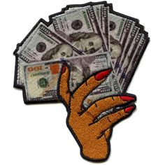 a hand that has money in it on top of a pile of cash patches, with the image of a woman's hand holding several hundred dollar bills