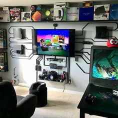 a living room filled with furniture and a flat screen tv sitting on top of a wall