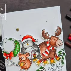 a handmade christmas card with some animals on it