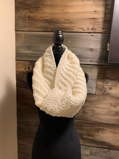 Looking for a fabulous winter look?  Then you have found it here with this scarf.  This cream coloured infinity scarf is soft, warm and stylish.  It will keep away the chill.  Made with a soft cream blended yarn(20% wool), it is machine washable.  Lay flat to dry. Acrylic Yarn Scarf For Cold Weather, Cozy Winter Loop Scarves, Cold Weather Acrylic Yarn Scarves, Cold Weather Acrylic Yarn Scarf, One Size Loop Scarf For Winter, Knit Infinity Scarf One Size, Knitted One Size Infinity Scarf, One Size Loop Scarves For Winter, One Size Knitted Infinity Scarf