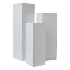 three tall white boxes sitting next to each other