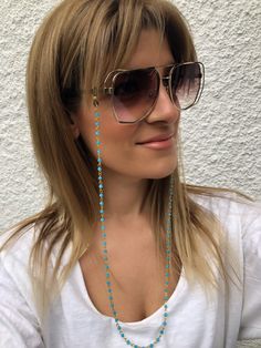 Sunglasses chain from a unique rosary with turquoise beads and gold chain. You can put it in every pair of sunglasses that you wish. In Christina Christi Jewels store you can see a lot of fashion accessories for men and women. You can have them in 2-4 Days with DHL EXPRESS SHIPPING - Rosary Chain with turquoise beads and gold chain that is made from metal. - You can choose in three different dimensions for your glasses. (70 - 80 - 90 cm) # FIND ALL MY DESIGNS IN GLASSES CHAINS HERE: https://etsy Blue Beaded Glasses Chain For Beach, Bohemian Gold Beaded Glasses Chains, Trendy Turquoise Beaded Chain Jewelry, Bohemian Blue Beaded Glasses Chains, Blue Adjustable Chain Glasses Chains For Summer, Blue Adjustable Glasses Chain For Summer, Summer Blue Glasses Chain With Adjustable Feature, Sunglass Chain, Rosary Chain