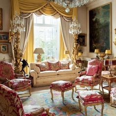 a living room filled with furniture and a chandelier