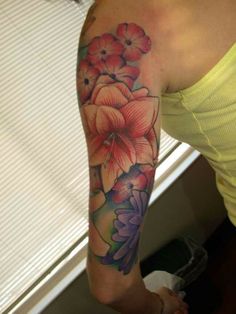 a woman with a flower tattoo on her arm