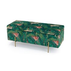 an upholstered bench with a tiger pattern on the top and legs, in front of a white background