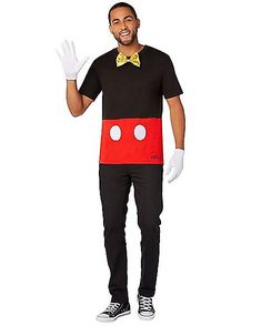 a man in mickey mouse costume standing with his hands out to the side and smiling