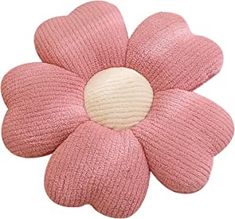 a pink knitted flower with a white center