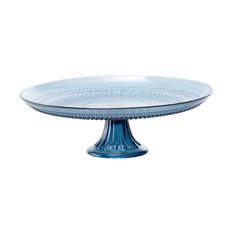 a blue glass cake plate on a white background