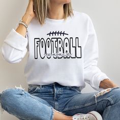 This Football Mom Sweatshirt is the perfect way to show your support for your favorite player on game day! Welcome to my store! **Please Note- this sweatshirt runs true to the size guide provided. If you would like it oversized, please size up** Ideal for any situation, a unisex heavy blend crewneck sweatshirt is pure comfort. These garments are made from polyester and cotton. This combination helps designs come out looking fresh and beautiful. The collar is ribbed knit, so it retains its shape Sports Fan Crew Neck Top For Game Day, Game Day Sports Fan Crew Neck Top, Game Day Crew Neck Sports Top, Crew Neck Tops For Game Day And Sports Season, Long Sleeve T-shirt For Baseball Game Day, Football Season Long Sleeve T-shirt With Team Logo, Varsity Crew Neck Top For Football Season, Long Sleeve Football Season T-shirt With Team Logo, Long Sleeve T-shirt With Team Logo For Football Season