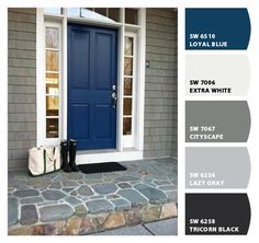 a blue front door with white trim and two black boots on the steps next to it