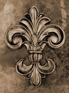 an old fashioned fleur de lis on the side of a building in black and white