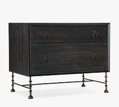 a black dresser with two drawers and metal legs