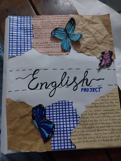 an english project book with butterflies on it