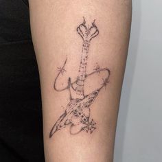 a tattoo on the leg of a woman with a guitar