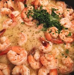 a skillet filled with shrimp and broccoli