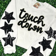 "One of our FAVORITE custom Game Day Patches! TOUCH DOWN  *Stars are NOT included, but can be purchased in this listing separately ~ Select the quantity in the pull-down menu *Sweatshirt is not included Size: 11\" Wide x 8\" Height Gold Glitter Backing Sequin Star: 5\" SOLD QTY 1 EACH @ $3.99 in this listing The stars are not sold as a set *There is a slight variation in color to the chenille patch but compliments nicely Iron it on most any garment or your favorite bag! The patch can also be glu Sequin Word Tshirt, Football Game Day Shirts, Shirt Patches, Game Day Shirt Ideas, Chenille Patch Ideas, Diy Sweatshirt Iron On, Iron On Sweatshirt Ideas, Iron On Patches Ideas, Vinyl Shirt Ideas