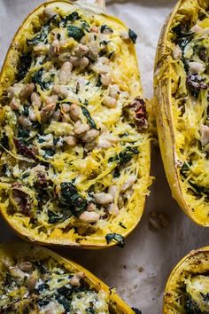 baked spaghetti dish with spinach and chickpeas in the middle on parchment paper