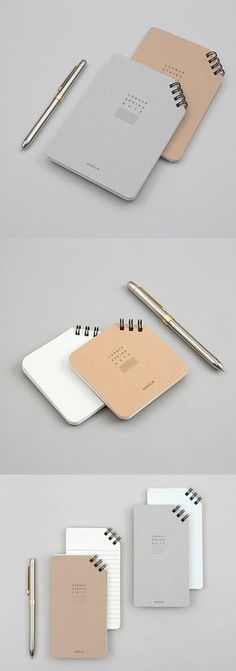 three different notebooks with pens and paper attached to the covers, all lined up on top of each other