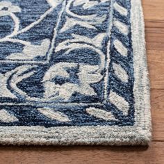 a blue and white rug on the floor