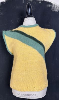 This is a nice and soft hand knitted wool vest. The vest is yellow with green stripes. MAKE: This one was found at a French vintage boutique which sells clothing from France, no labels. CONDITION: Very good. COMPOSITION: 100% wool. MEASUREMENTS: The measurements are taken lying flat and then doubled. Bust: 95cm/37" Waist: 95cm/37" Length: 57cm/22.5" Questions are always welcome! Have a look at my other items in my shop: https://www.etsy.com/ca/shop/vinylissimo Retro Green Sweater Vest For Winter, Pretty Cardigans, Pastel Stripes, Wool Vest, Vest Outfits, Soft Hands, Green Stripes, Vintage Boutique, Womens Vest