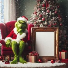 the grinch sitting in a chair next to a christmas tree