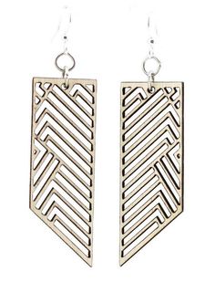 pair of earrings with geometric design on white background