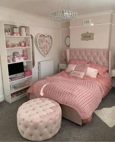 a bedroom with pink bedding and white furniture in the corner is decorated for valentine's day