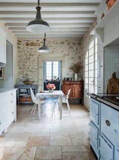 the kitchen is clean and ready to be used as a dining room or breakfast nook