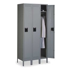 a large gray locker with two doors and towels hanging on the door, in front of a white background