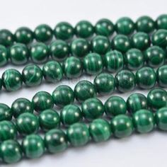 the beads are green and white in color