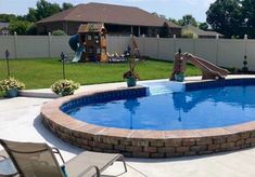 a backyard with a swimming pool and slide