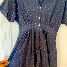 Christy Dawn Midi Dress. Navy Floral Pattern, Snap And Button Front Enclosure, Chest And Skirt Pockets. Brand New Without Tags, No Longer Available On Website. Bought New But I Couldn’t Get It To Fit I Had The Shoulders Taken Up (See Pic) & The Seamstress Removed The Tags. Would Be Very Cute On A Person With A Good Bust! The Shoulders Could Also Be Taken Back Out. Retro V-neck Dress With Buttons, Rayon Short Sleeve Dress With Buttons, Short Sleeve Rayon Dress With Buttons, Blue Short Sleeve Dresses With Buttons, Retro V-neck Dress With Button Closure, Rayon Day Dresses With Buttons, Rayon Buttoned Dresses For Daywear, Daywear Dresses With Buttons Made Of Rayon, Rayon Daywear Dresses With Buttons