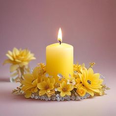 a yellow candle surrounded by flowers on a pink background with crystal beads and pearls around it