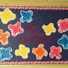 a bulletin board with handprints on it that says our little fireworks