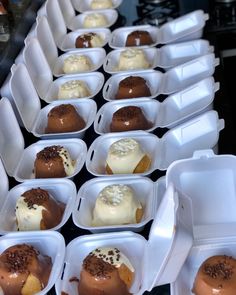 there are many desserts in plastic containers on the table, ready to be eaten