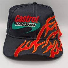 Add A Touch Of Racing Style To Your Wardrobe With This Vintage Castrol Racing Hat Featuring A Flame Design. This Adjustable Snapback Has Only Been Tried On But Never Worn, Ensuring It's In Pristine Condition. Perfect For Collectors Or Racing Enthusiasts! This Item Comes From A Smoke-Free And Dog-Free Home. Our Items Are Carefully Packed To Guarantee Their Safe Arrival To You. #Racing #Castrol #Racinghat #Snapback #Snapbackhat #Racingchampions #Autoracing #Cbtreasures Racetrack Hat, Phoenix Aesthetic, Cool Beanies, Random Clothes, Races Style, Custom Caps, Racing Gear, Flame Design, Hat Ideas