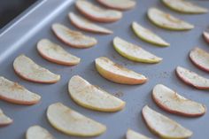 an image of apple slices on a baking sheet