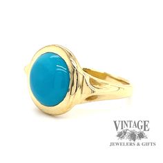 The combination of yellow gold and turquoise, though not seen as often as other metals, offers a striking contrast. The round cabachon fine turquoise in this estate ring is often referred to as "robin's egg" blue with almost no secondary coloration, and is usually considered the most desirable color. It is bezel set in a polished 18 karat yellow gold setting with triangular gold buttresses incorporated into the shoulder design, tapering down to a 2.5 mm shank. The ring is size 5.5. Classic Gold Turquoise Ring With Round Shape, 14k Yellow Gold Turquoise Cabochon Ring, Classic Yellow Gold Turquoise Ring, Classic Yellow Gold Turquoise Cabochon Ring, Blue Turquoise Oval Cabochon Ring In 14k Gold, Blue Oval Cabochon Turquoise Ring In 14k Gold, Blue Turquoise 14k Gold Oval Cabochon Ring, Gold Turquoise Cabochon Ring In 14k Gold, Classic Cabochon Turquoise Ring In Yellow Gold