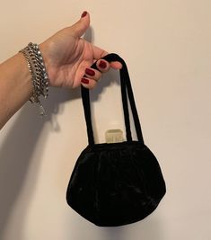 This black velvet evening bag is a great art Deco bag Velvet purse evening bag with lucite 30s 40s style! In good vintage condition has one small brown dye stain and shows wear at base of handles. Non-smoking home. Please contact me with any other questions! Product details: measures 7 1/2 inches wide by 3 inches deep at bottom lucite is 1 1/4 inch wide by 1 inch tall frosted lucite closure is off white to light yellow color Thank you for supporting small business  VISIT MY SHOPS HERE   * http://www.etsy.com/shop/HappyCatHouse * http://www.Etsy.com/shop/AnEnchantingCreature  CONNECT  * http://www.facebook.com/EnchantingCreature * https://instagram.com/enchantingcreature * https://www.pinterest.com/enchantingcreature * @EnchantingCreature  NEW TO ETSY?  A great tutorial to answer all of you Vintage Evening Coin Purse Pouch, Vintage Handheld Evening Bag, Vintage Black Handheld Evening Bag, Vintage Black Pouch Evening Bag, Vintage Handheld Evening Bag For Events, Vintage Pouch Coin Purse For Party, Vintage Pouch Bag For Events, Black Vintage Handheld Clutch, Retro Rectangular Coin Purse For Evening