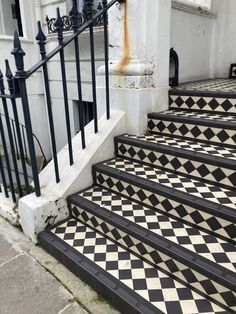 black and white tiled steps leading up to a building