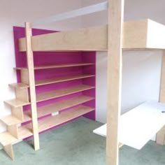 there is a bunk bed with purple shelves in the corner and a white shelf below it