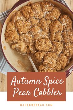 a close up of a bowl of food on a table with the words autumn spice pear cobbler