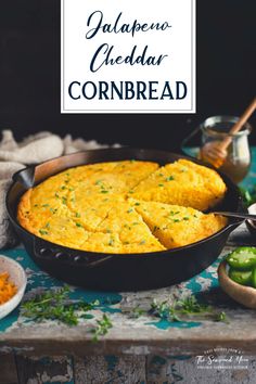 cornbread in a cast iron skillet with green peppers and jalapeno cheddar