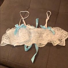 Nwot! Never Been Worn! Beautiful White Lacy Bra Tied In The Back With A Baby Blue Ribbon Features Adjustable Straps. Sheer And Not Padded. Elegant Blue Bra With Lace Trim, Fitted Blue Bra With Lace Closure, Light Blue Bra, Cheap Blue Lace Intimates, Blue Lace Bra, Lacy Bra, Lace Bra, Blue Ribbon, Women's Intimates