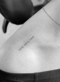 a woman with a tattoo on her shoulder that reads, never steal and be happy