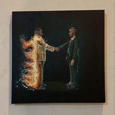 a painting of two men shaking hands in front of a fire - breathing object on a wall