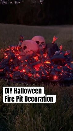 a pile of fake skulls sitting on top of a blanket covered in fire pit decorations