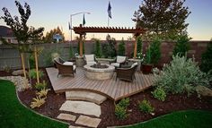 an outdoor patio with seating area and fire pit