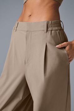 A shorter version of our best-selling Pursuit Trousers, this modern fit is the ultimate closet staple. They have a high-rise waistband (flat in front and stretchy in back), tailored details (belt loops and pleats), and a relaxed, wide-leg fit. Plus, they’re made from a lightweight, stretch-infused fabric that looks sleek and feels totally comfortable. You'll go straight from work to your weekend plans with just a change of shoes. Relaxed Fit Trousers, Trousers Details, Gray Accessories, Weekend Plans, Womens Capris, Golf Pants, Tank Top Long Sleeve, Fitted Trousers, Sweaters Knitwear